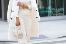 a white turtleneck, a slip midi skirt, white shoes, a white bag and an embllished bag and gold accessories