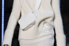 a white turtleneck sweater, a white sequin skirt and a small crossbody bag for a beautiful winter bridal shower look