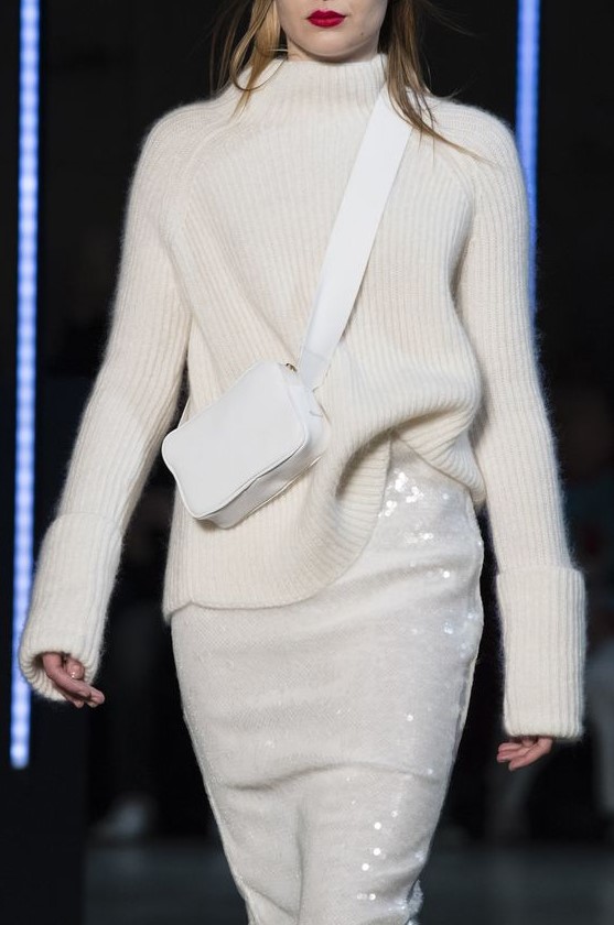 a white turtleneck sweater, a white sequin skirt and a small crossbody bag for a beautiful winter bridal shower look