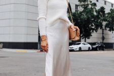 a winter bridal shower look with a turtleneck, a silk slip midi, nude shoes and a camel bag