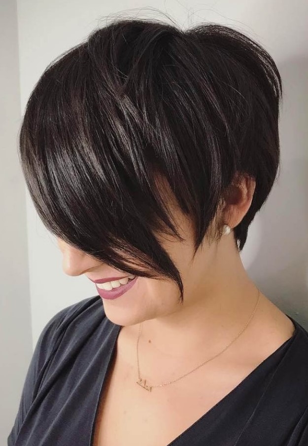 an asymmetrical pixie cut with long bangs is flattering for square faces