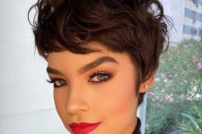an eye-catching dark brown pixie with waves, long bangs and volume on top is a fresh and catchy idea