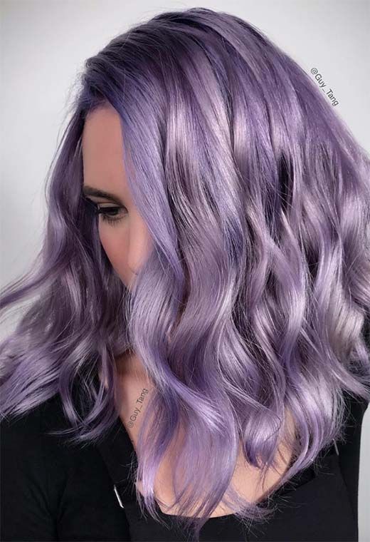 beautiful medium-length purple wavy hair with a lot of volume and side parting looks absolutely amazing