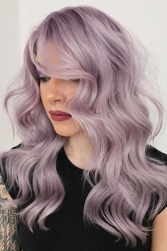beautiful pale lavender hair with a lot of volume and waves loosk decadent and very chic, this cold shade compliments the face features