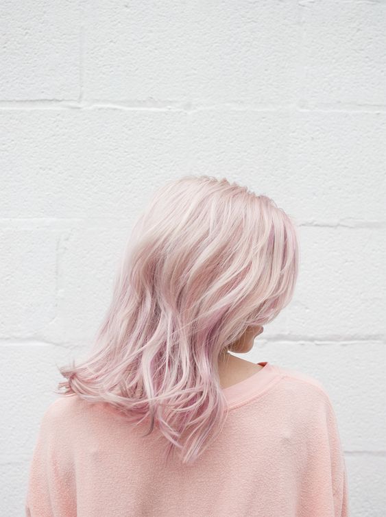 delicate medium-length pale pink hair with messy waves is a super chic and catchy solution that makes the look softer
