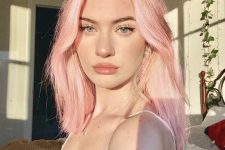 dreamy pastel pink medium-length hair with some volume looks chic, cool and lovely and makes you wow