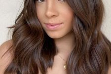 elegant medium-length chocolate brown hair with waves and chestnut highlights is a stunning idea for trying