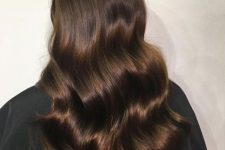 fantastic long chocolate brown hair with waves and a lot of volume is an eye-catchy idea to rock, it looks pretty chic