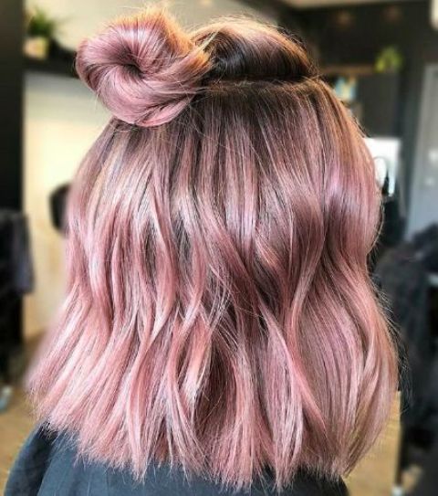 Gorgeous rose shoulder length hair with a bit of waves and a top knot is amazing, it looks soft and delicate