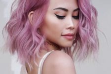 gorgeous shoulder-length pink hair with a slight ombre effect and waves is a cool solution, and much volume makes it even cooler