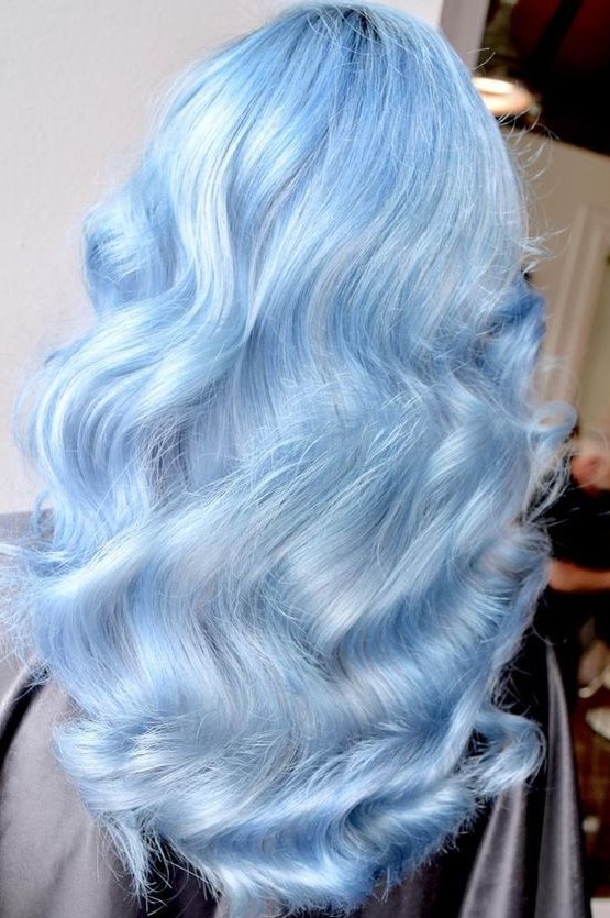 Jaw dropping pastel blue hair with natural waves is a chic and stylish idea for a pastel loving person