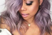 lilac hair with a darker root is another cool and trendy idea to try, feel free to rock waves to give more volume to your hair