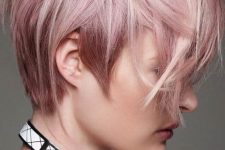 long and messy layered pastel pink pixie with bangs is a cool and catchy solution for a delicate look