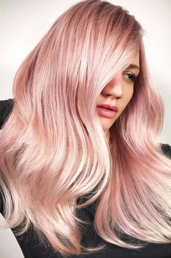 long and shiny peachy rose gold hair with a bit of waves is a cool idea, it will show off your locks with a catchy color