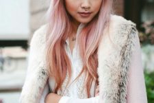long and wavy peachy rose gold hair with a bit of darker locks on the ends for creating an ombre effect is wow