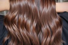 long chocolate brown hair of a lighter shade, with waves and a bit of volume is a stylish idea if you don’t want to go into dark shades