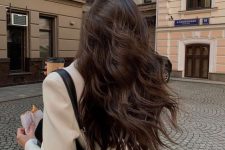 long chocolate brown hair with waves and volume is a stylish and elegant idea to try in the fall or winter