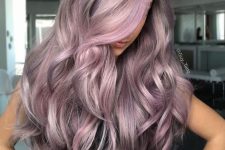long lilac and mauve hair with waves and a bit of volume is an amazing idea, this is a delicate hair color that catches an eye