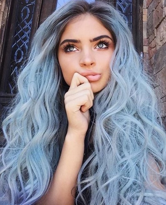 long pastel blue hair with a darker root and waves is a fantastic idea for a modern mermaid