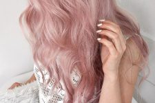 long pastel pink hair with a lot of volume and texture is a cool idea, you can rock it in any season and look gorgeous