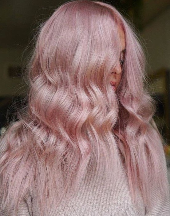 long pastel pink hair with a touch of texture and a bit of waves are a lovely and very romantic combination