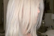 long platinum blonde hair with layers and a lot of volume is a lovely idea, straight hair or waves are up to you