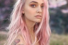 long wavy pastel pink hair with much texture and a pink smokey eye to finish off the look