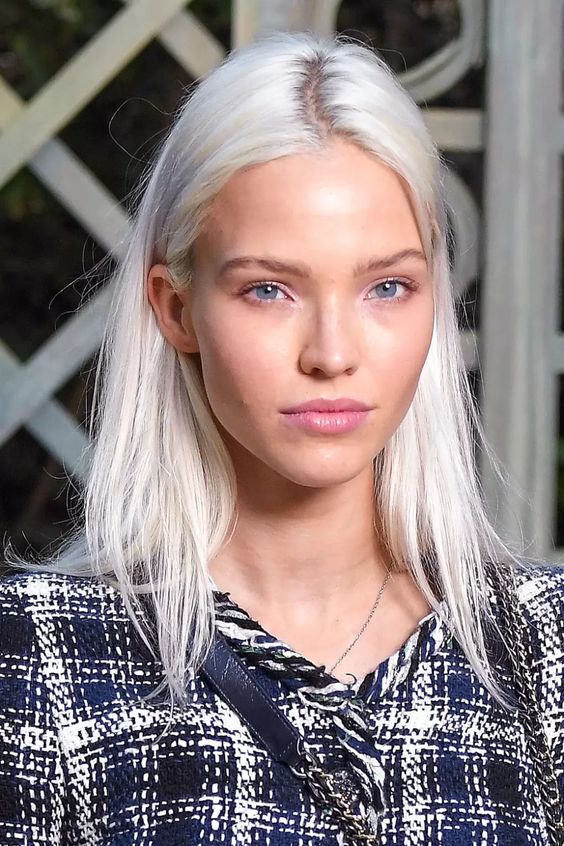 lovely platinum blonde long hair with a bit of texture is a cool idea, such a hair color pefectly matches  the girl's eyes
