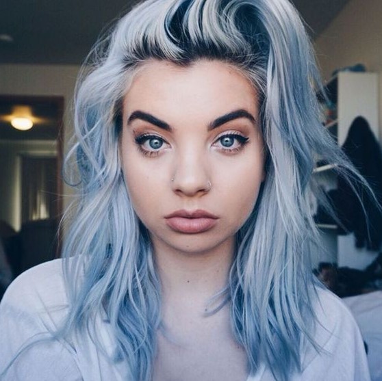 Lovely shaggy and textural medium length pastel blue hair with a darker root is a gorgeous solution
