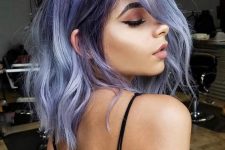 medium-length blue and purple hair with some textural waves is a lovely idea for a chic look, the mix of colors is wow