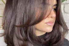 medium-length chocolate brown hair with layers and a lot of volume is a stunning idea to rock, it looks elegant and stylish