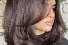 medium-length chocolate brown hair with layers and a lot of volume is a stunning idea to rock, it looks elegant and stylish
