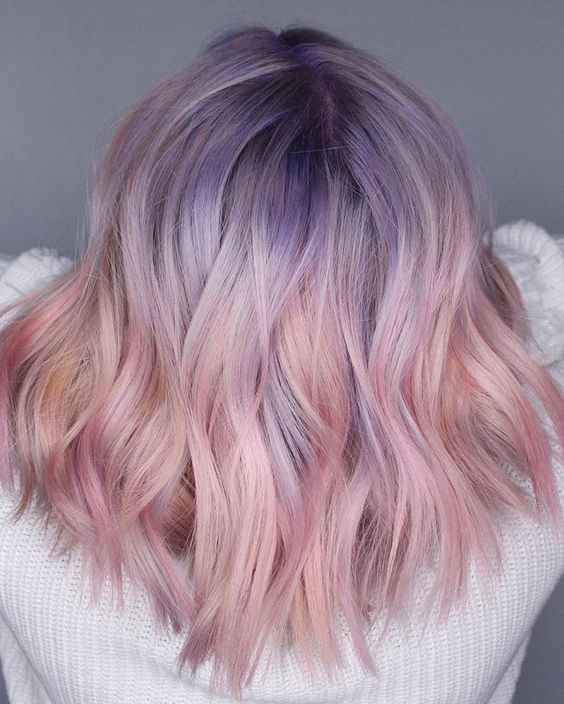 Medium length pastel hair with purple root and pink ends is a very eye catching and lovely solution