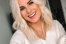 medium-length platinum blonde hair with a bit of wavy texture and volume is a lovely idea for a romantic modern look