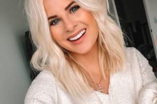 medium-length platinum blonde hair with a bit of wavy texture and volume is a lovely idea for a romantic modern look