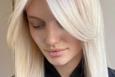 medium-length platinum blonde hair with middle part and side bangs framing the face is a lovely idea