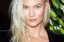 medium-length platinum blonde hair with side part and a lot of texture is a very stylish and cool idea