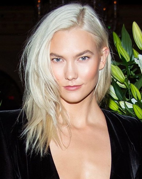Medium length platinum blonde hair with side part and a lot of texture is a very stylish and cool idea