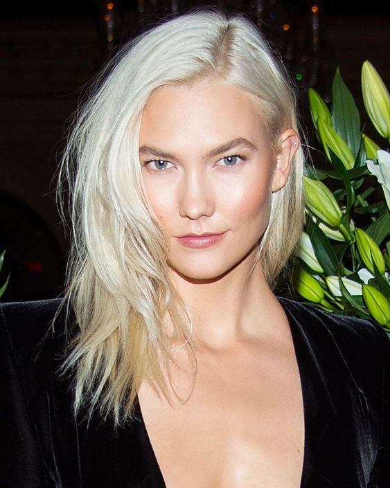 medium-length platinum blonde hair with side part and a lot of texture is a very stylish and cool idea
