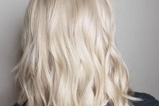 medium-length platinum blonde hair with waves and a bit of volume is always a beautiful and chic idea