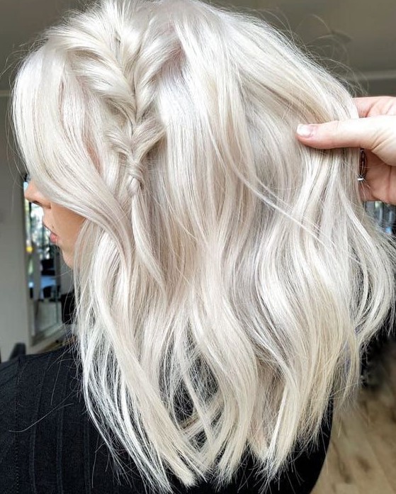 medium-length platinum blonde hair with waves, volume and a small braid on top is a lovely idea, and you may style such hair in many ways
