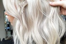 medium-length platinum blonde hair with waves, volume and a small braid on top is a lovely idea, and you may style such hair in many ways