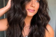 medium-length wavy hair with a bit of baby lights and a lot of volume is a chic and cool idea to rock