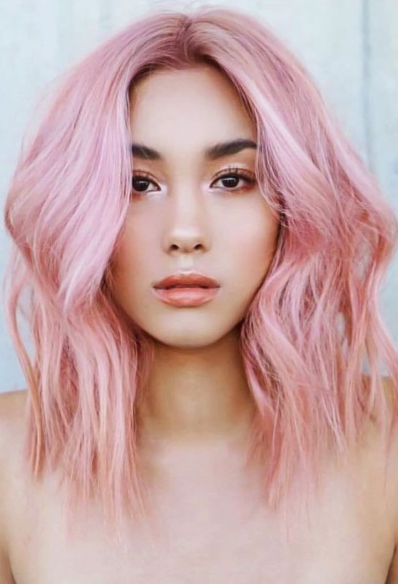 Pink shoulder length hair with a bit of waves and much volume is a gorgeous idea for a fashion forward girl