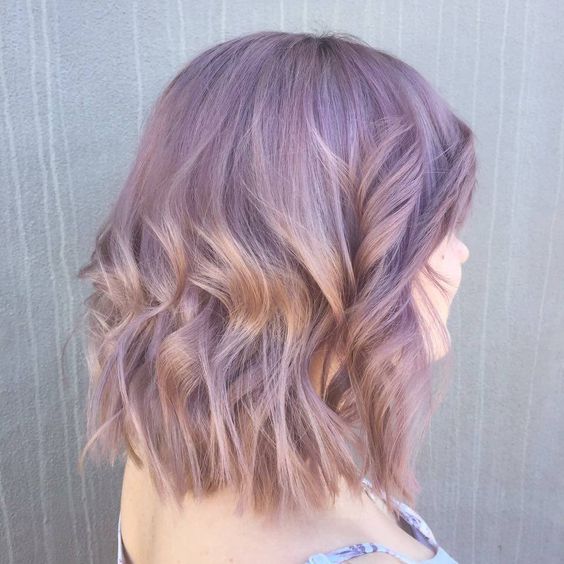 shoulder-length lilac hair with waves and volume is a cool and chic idea, and this delicate color will add softness to the look
