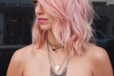 shoulder-length pastel pink hair with much texture and waves is a girlish and chic idea, it’s a trendy color