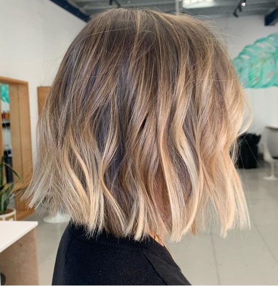 a beautiful bronde blunt bob with waves and a dark root is a stylish and catchy idea, especially with this volume