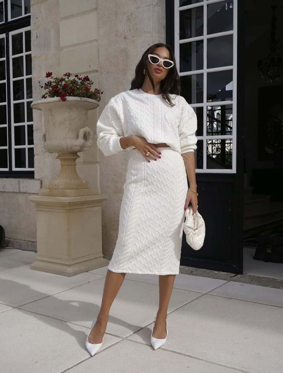 A beautiful knit co ord with a crop top and a midi skirt, white shoes and a bag are a lovely combo for a bridal shower