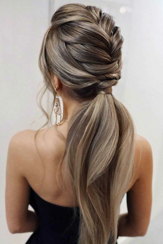 a beautiful low ponytail with a braided top and a low of volume, with wavy hair down is amazing