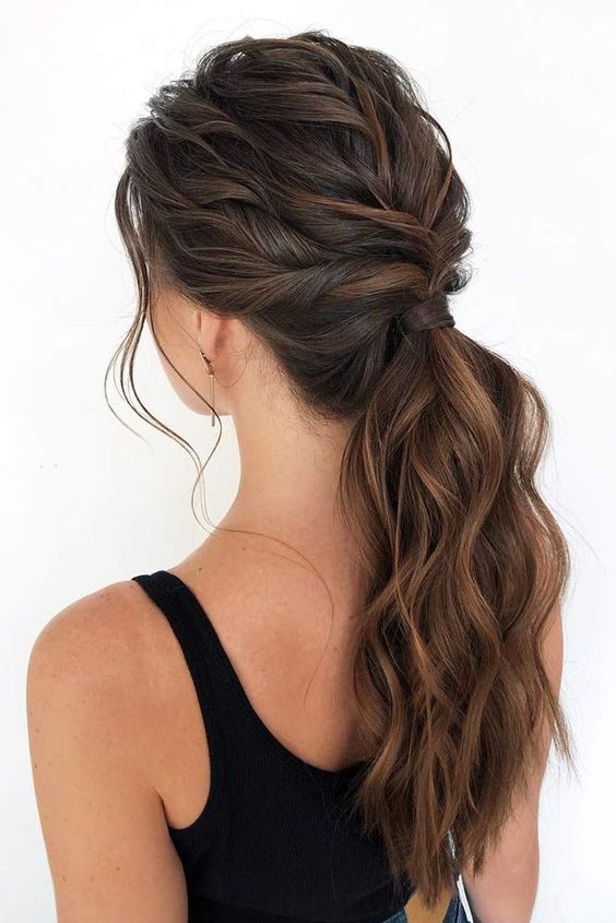 a beautiful low wavy ponytail with a volumetric wavy top is a hairstyle that works for many occasions